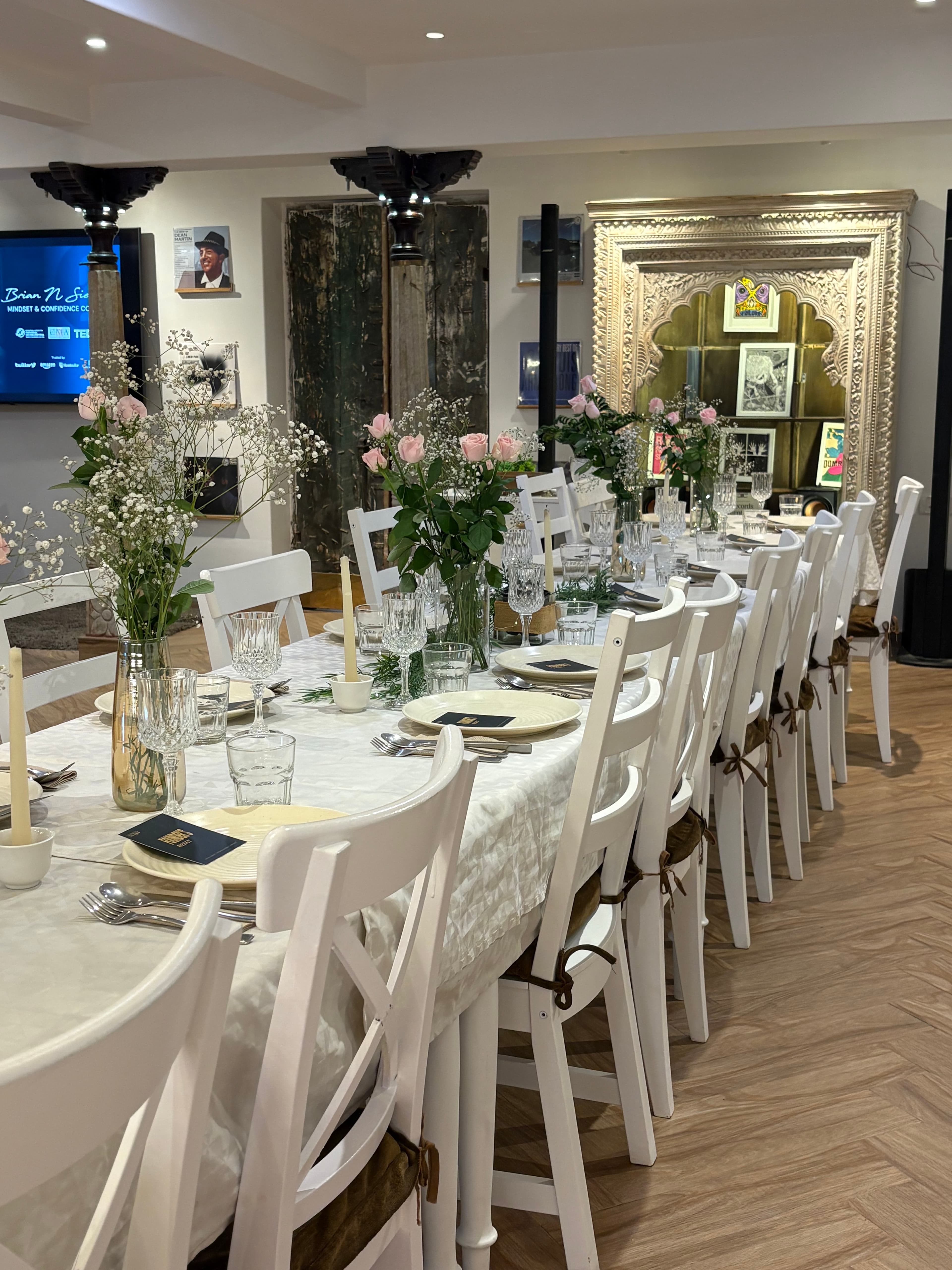 An elegant SVYA Circle table with florals, candlelight, glassware, and refined place settings